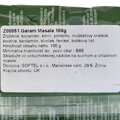Detail zadnej slovenskej etikety na obale korenia Garam Masala. Zloženie presne vymenúva tradičné ingrediencie: koriander, kmín, pimento, muškátový oriešok, korenie, kardamón, klinček, fenikel a bobkový list. Etiketa obsahuje pokyny na skladovanie vo vzdu