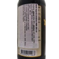 Detailný záber na bielu slovenskú etiketu nalepenú na boku fľaše. Názov produktu je uvedený ako "8638 Sójová omáčka HBB 250 ml". Zloženie v slovenčine potvrdzuje obsah sójových bôbov (35 %), pšenice, soli, vody, cukru a prídavných látok (E150c, E631, E627
