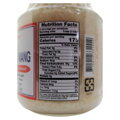 Bočná strana skleneného pohára sladkej fermentovanej lepkavej ryže Kimlan. Detailný pohľad na americkú tabuľku nutričných hodnôt (Nutrition Facts), ktorá uvádza 175 kalórií na porciu a podiel sacharidov. V pozadí presvitá hustá štruktúra naložených bielyc